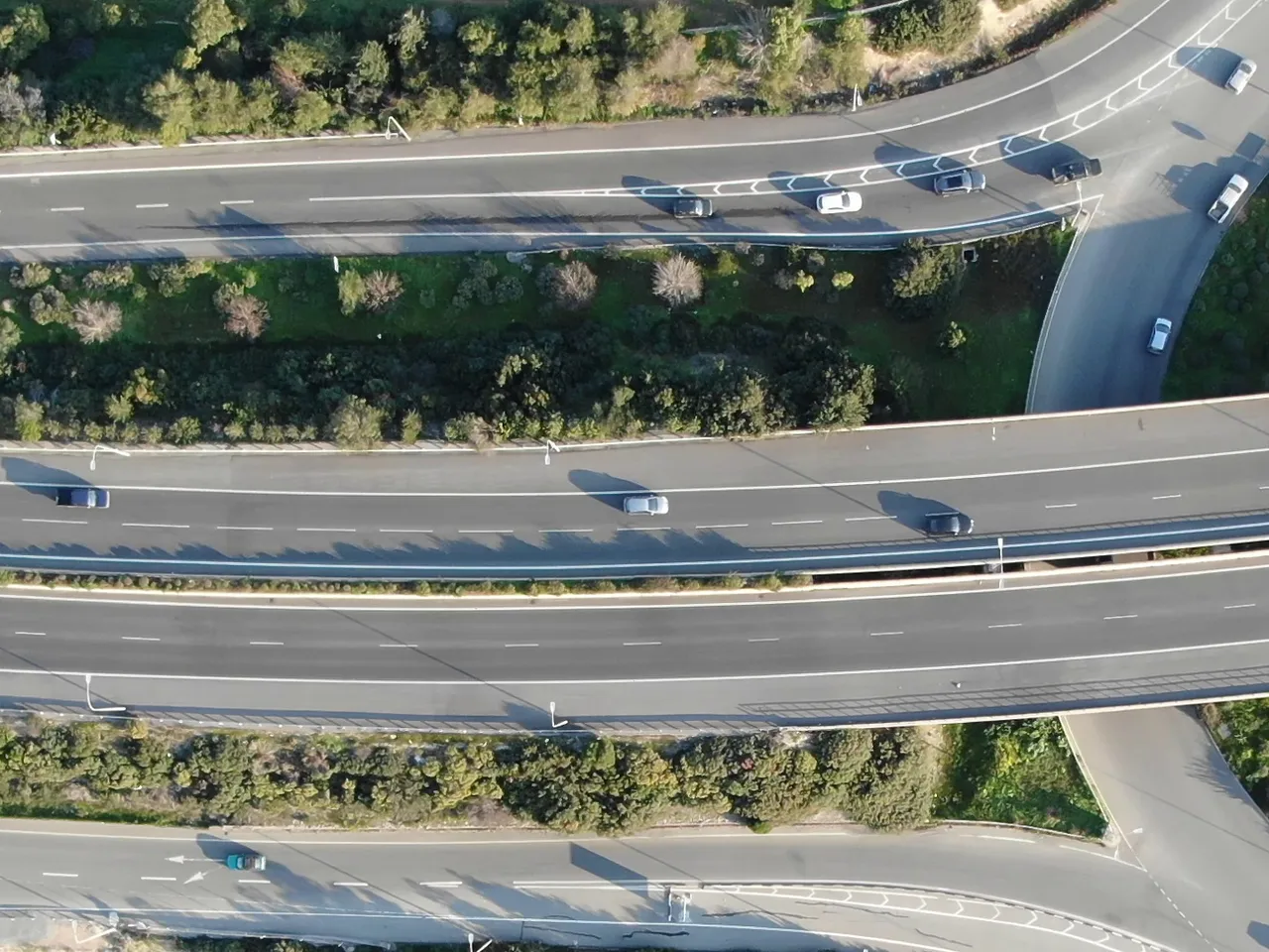 A drone photo of a road junction with queues of cars: a part of it with 11 vehicles, and the 24 boxes Claude Sonnet 5.5 (adaptive thinking) returned there.
